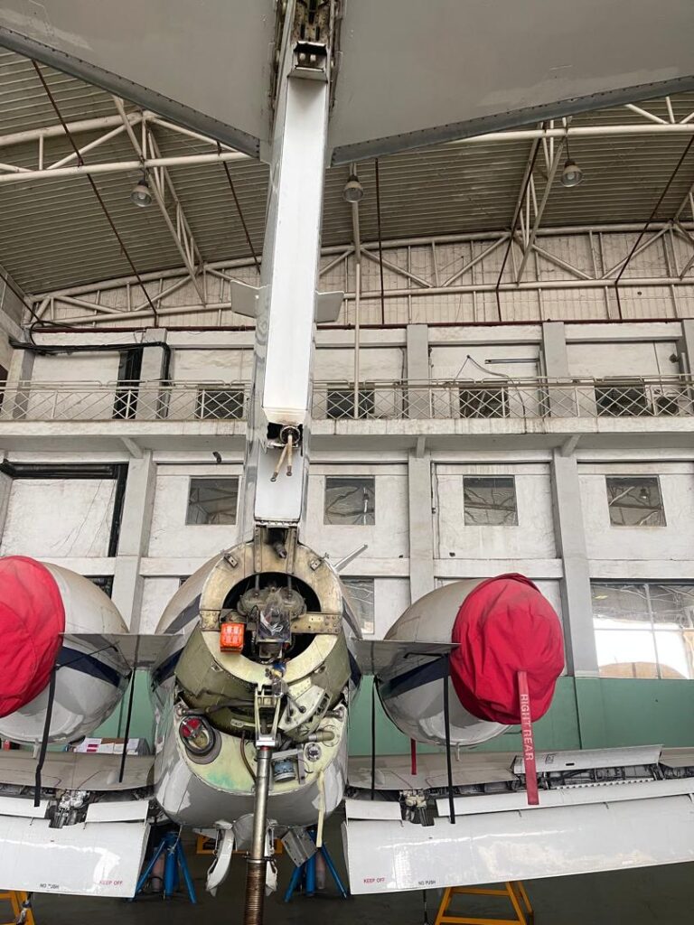 Symmetrical rear view of business jet 5N-BOO with red engine covers in the DJSD Lagos hangar